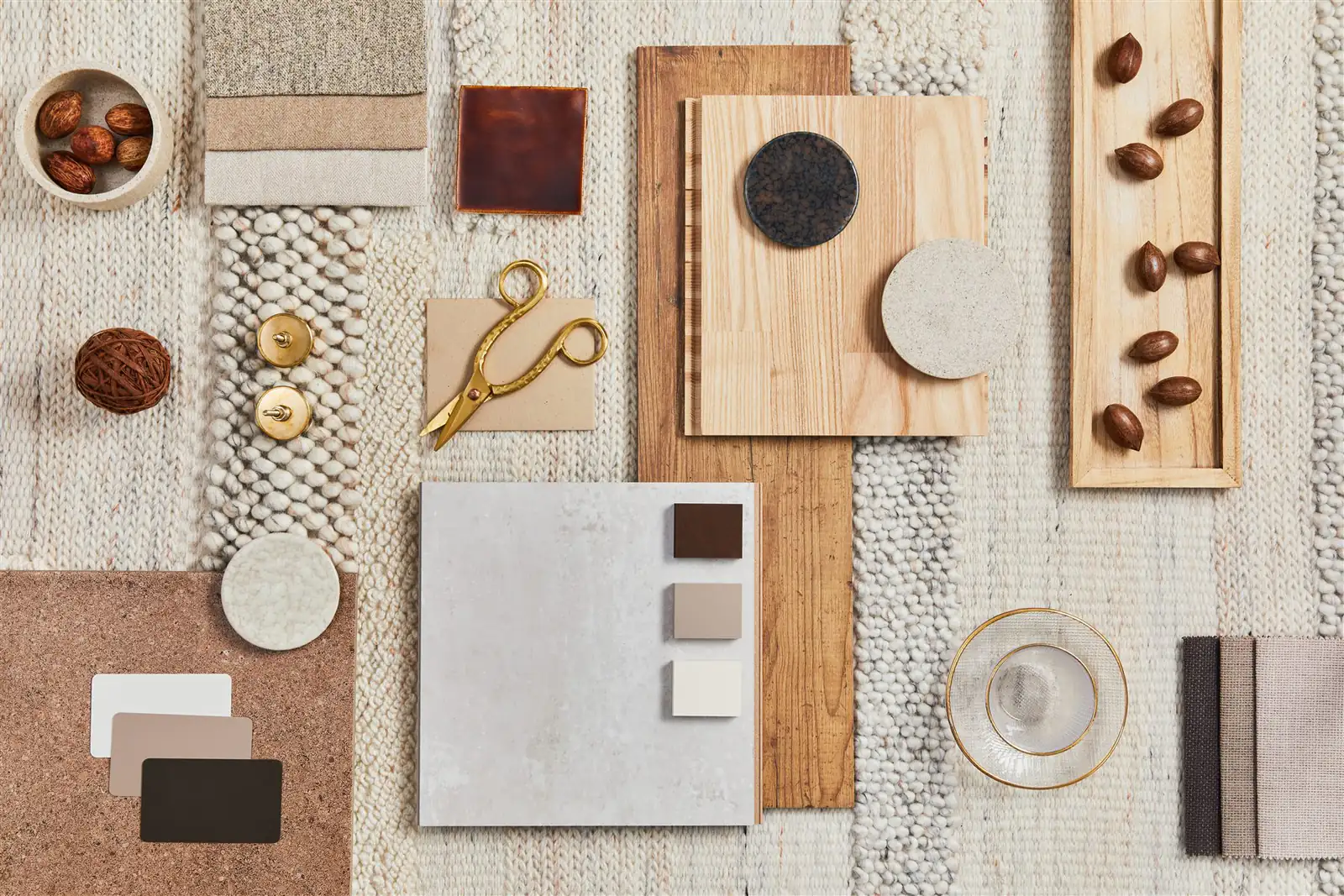 Tile, wood, and hardware samples arranged for finish planning