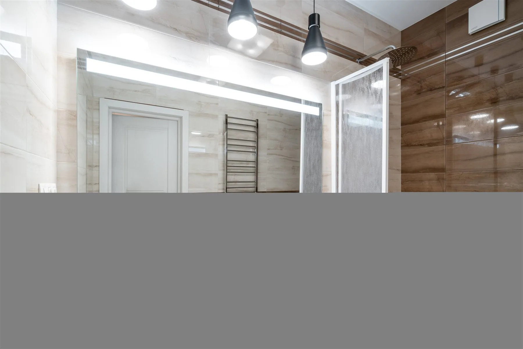 Finished bathroom with a glass shower and freestanding tub